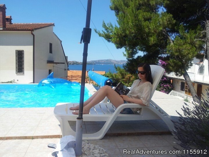 Reading Book In Shadow | Holiday in quiet location-pool-near beach and town | Image #8/12 | 
