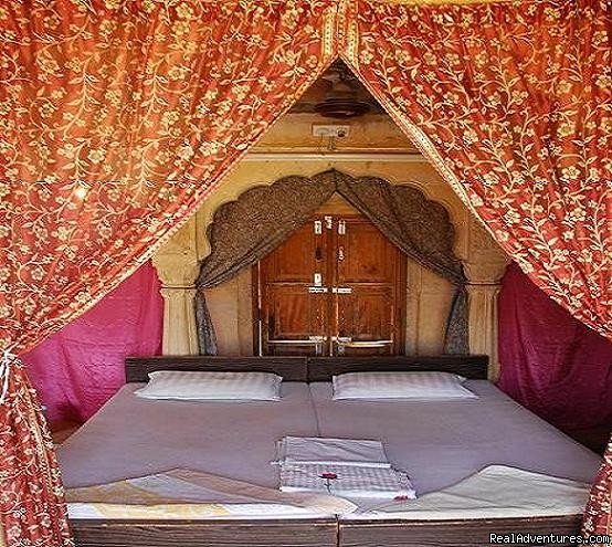 Bed with saree curtains. | HAVELI Hotel SURAJ | Image #3/13 | 