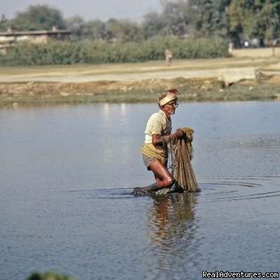 Fisherman at a lake in Pakistan | Pakistan Travel and culture Services | Karachi, Pakistan | Sight-Seeing Tours | Image #1/4 | 