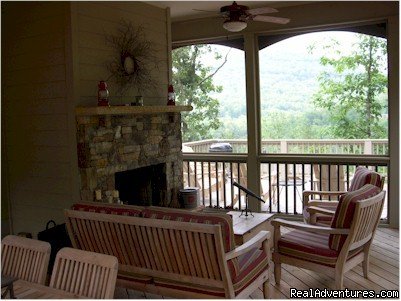 Screened Porch with seating for everyone next to woods | Image #4/15 | Mountain Vista Home Rental in Big Canoe Resort
