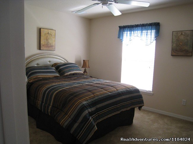 Queen Bedroom with own ensuite and TV | Disney Vacation Pool Home -Backs onto Conservation | Image #2/13 | 