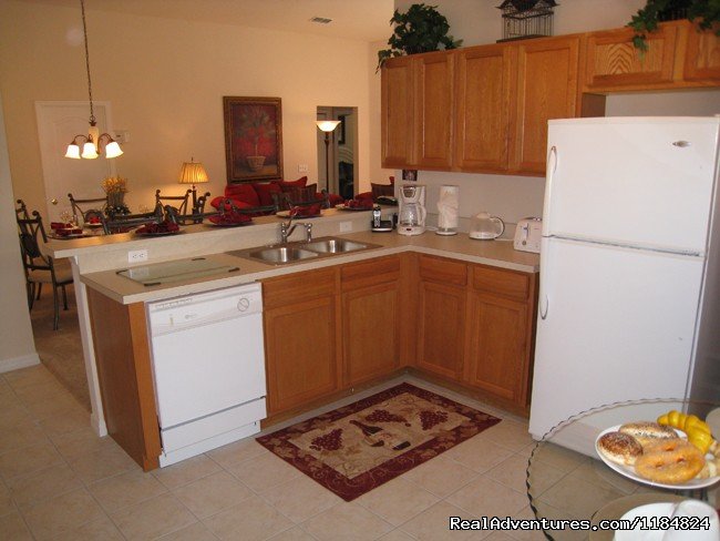 Fully Equipped Kitchen | Disney Vacation Pool Home -Backs onto Conservation | Image #10/13 | 