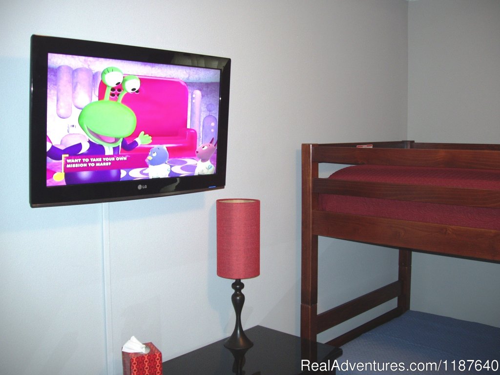 They will enjoy a new wall-mounted flat screen TV, too | 'WELCOME TO POTTER'S CASTLE' Disney World | Image #12/22 | 