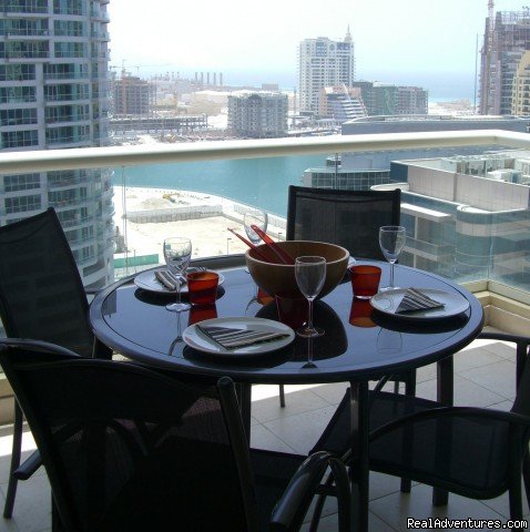 Second balcony with seating and view of Marina | Corner 1-bed apartment sea/Marina view in Dubai | Image #9/14 | 
