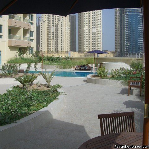 Terrace with view of pool and Marina | Corner 1-bed apartment sea/Marina view in Dubai | Image #13/14 | 