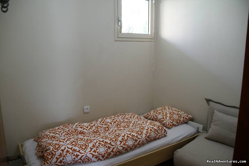 Kids Room - 2 single beds | Luxury Garden Apartment in Neot Golf Caesarea | Image #9/11 | 
