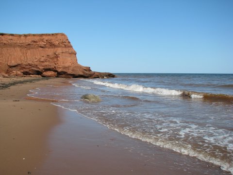 The west view of the beach including the island cape