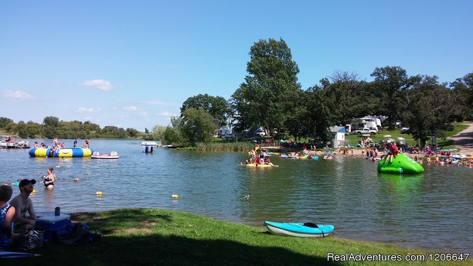 Awesome water toys in our swimming area with 2 beaches | Lake Joy Campground- Family Friendly Lake Getaway | Image #3/3 | 