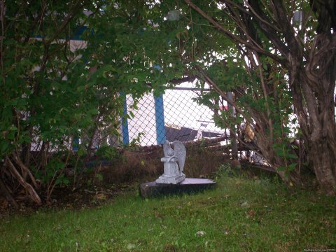 Praying angel in the corner garden