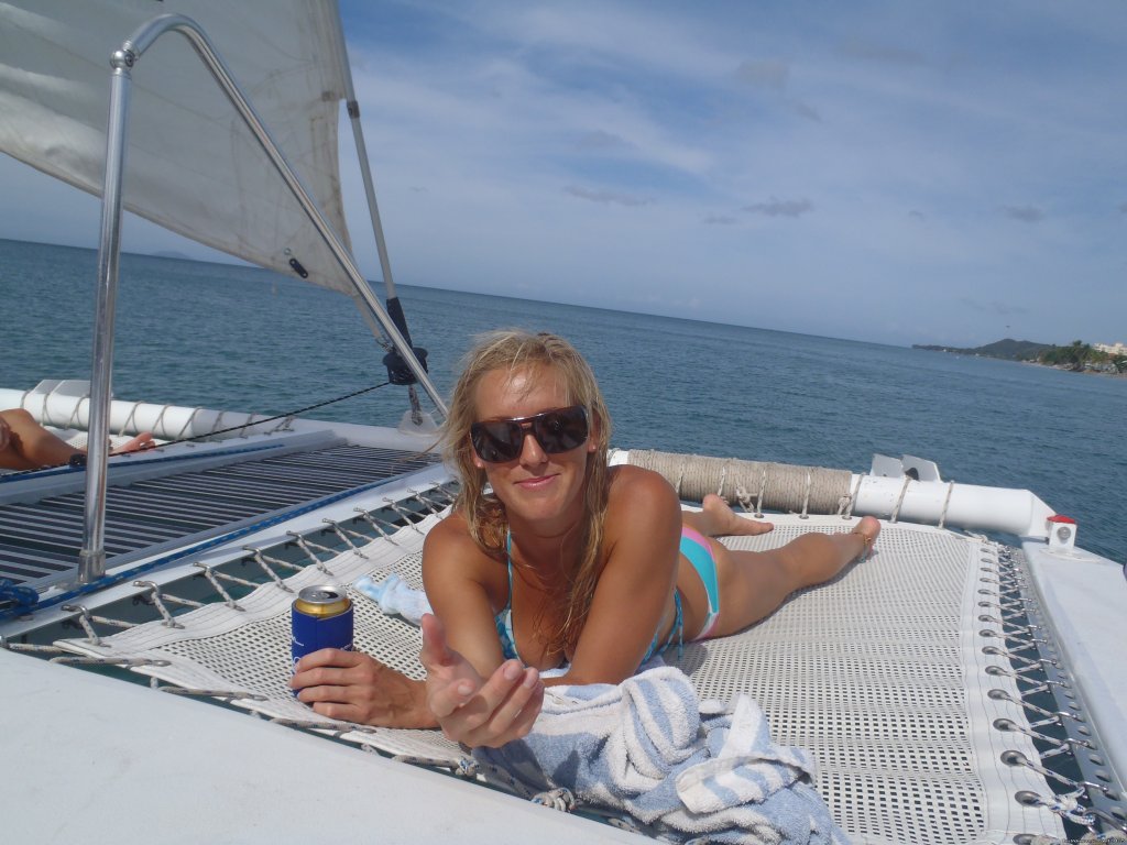 sunning on the nets | Sail, snorkel, shine, relax aboard the Katarina | Rincon, Puerto Rico | Sailing | Image #1/10 | 
