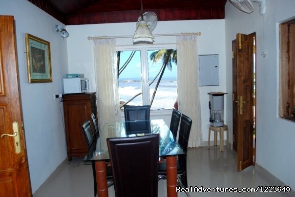 The dining area which also has a view of the sea | Ocean Hues Beach House - Seaside Holiday in Kerala | Image #10/20 | 