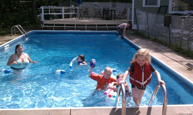 Family time at the pool! | Cozy Inn-Lakeview House & Cottages in Weirs Beach | Image #2/3 | 