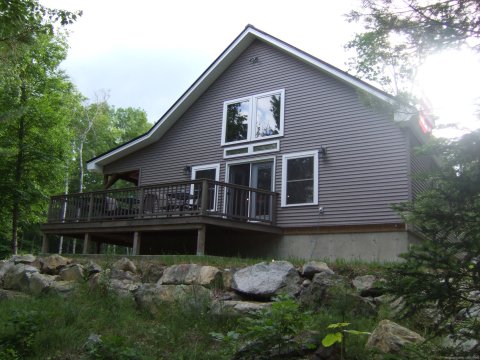 This is a new post and beam home (cottage) with 2.5 baths, laundry, full kitchen, 80' of deck (24' screened in) 100' from the water with trophy brook trout. 2 kayaks, dock and beach available. Very quiet. 1.5 hours to Acadia - Bar Harbor- Bangor.