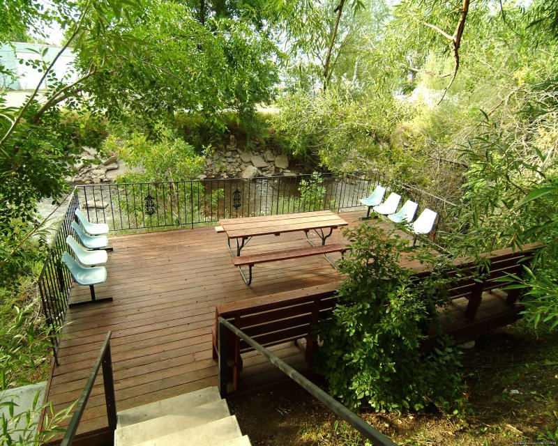 Deck on Popo Agie River | Rodeway Inn & Suites Pronghorn Lodge | Image #4/13 | 