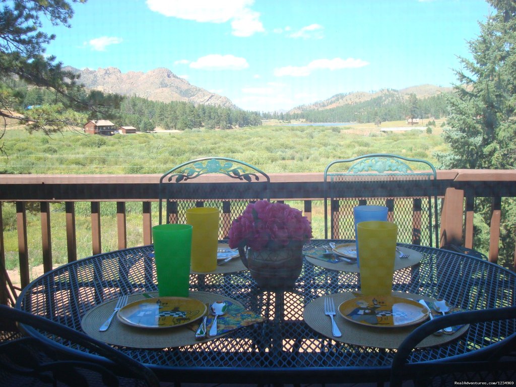 Have a meal on the deck and enjoy the view. | Pikes Peak Retreat In Pikes National Forest | Image #13/26 | 