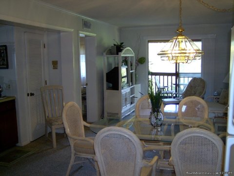 Dining into Living area and Sliding doors | Image #13/16 | OCEAN RESORT w/Largest Pool On Island On Beach