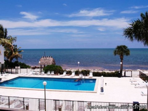 View of the pool and beach from balcony