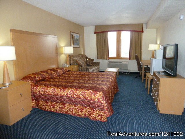 King Size Bed with Pull Out Sofa | Katahdin Inn & Suites | Millinocket, Maine  | Hotels & Resorts | Image #1/11 | 