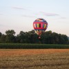 Sky Riders Balloon Team Hovering over a corn field