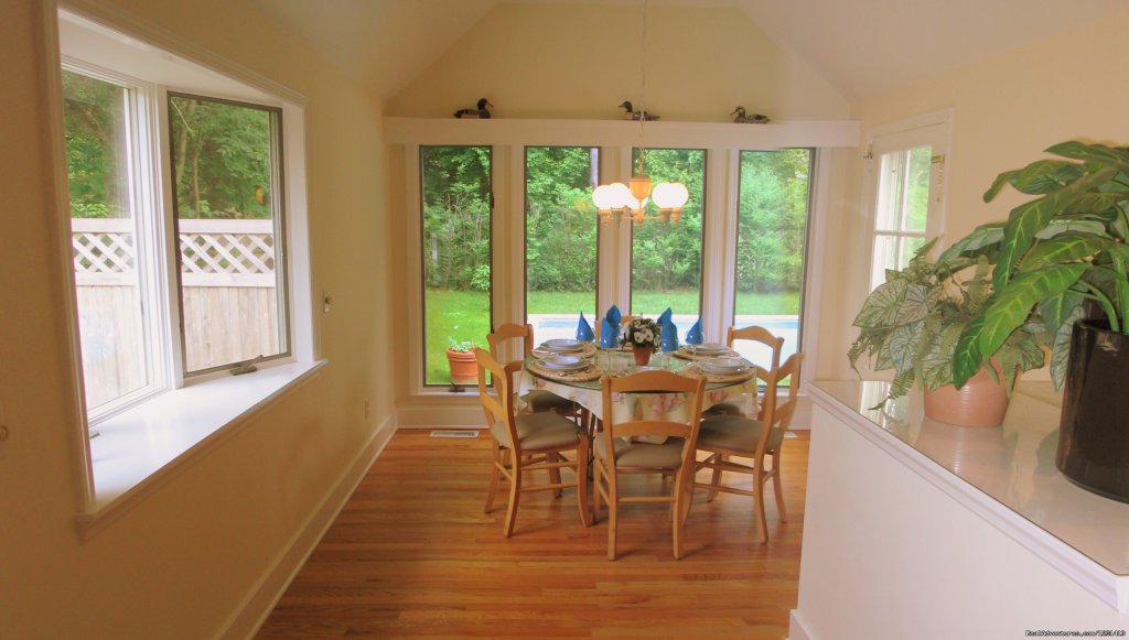 Dining room with view of swimming pool (seats 6). | Charming & Private - Heart of East Hampton Village | Image #4/7 | 