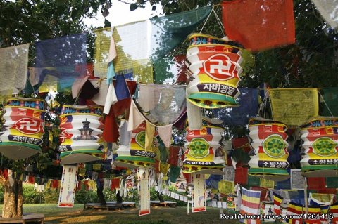 A mixture of Tibetan prayer flags and Korean lanterns near t