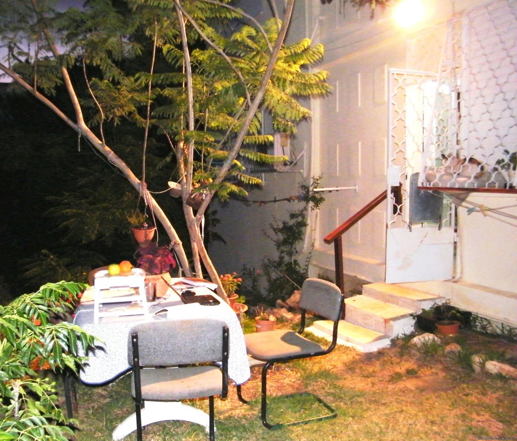 At Nights: Out Door Yard With A Table And Chairs | Stella- Maris Hosting: Vacation  Rental | Image #13/17 | 