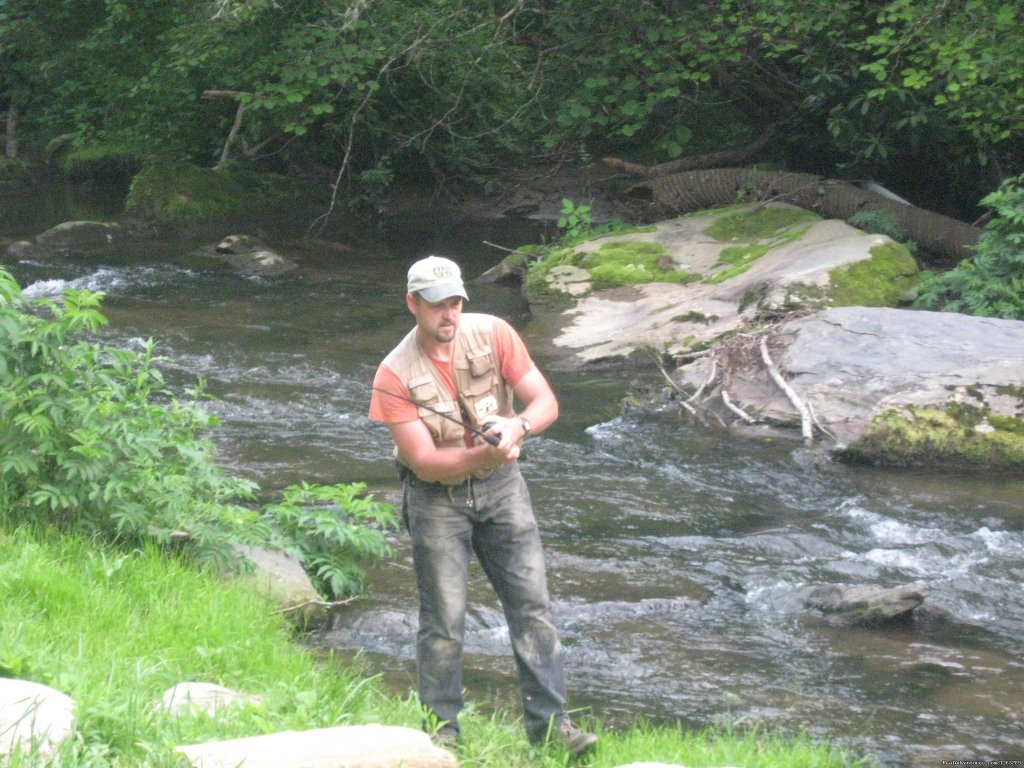 One of our guest fly fishing | Luxury Cabin on Beautiful Mt Stream $199/nightly | Image #4/20 | 