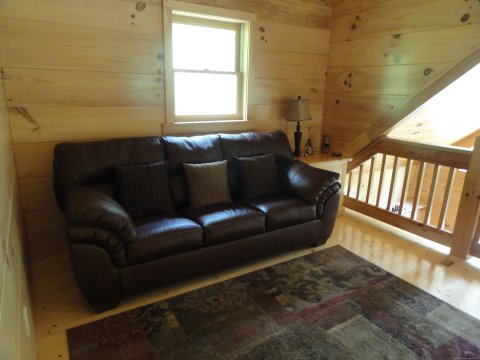Sleeper Sofa up in loft area | Image #17/20 | Luxury Cabin on Beautiful Mt Stream $199/nightly
