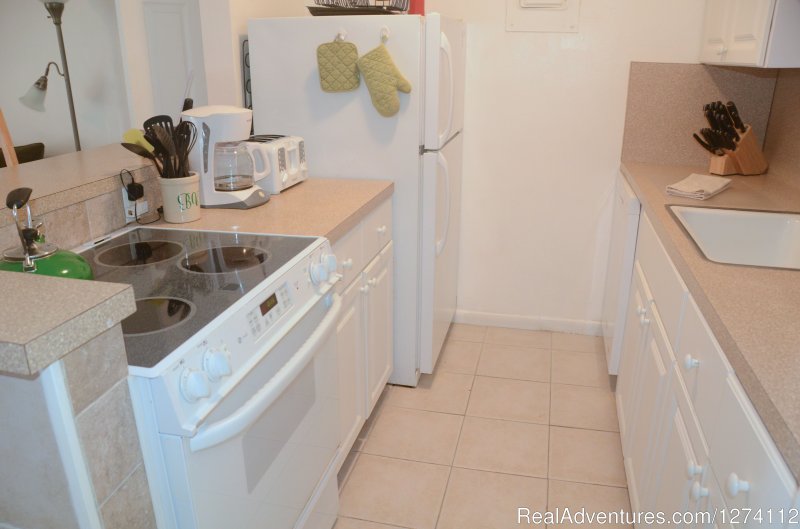 Kitchen of 1/1s and 2/2 | Pineapple Place - South Florida great getaway | Image #11/26 | 