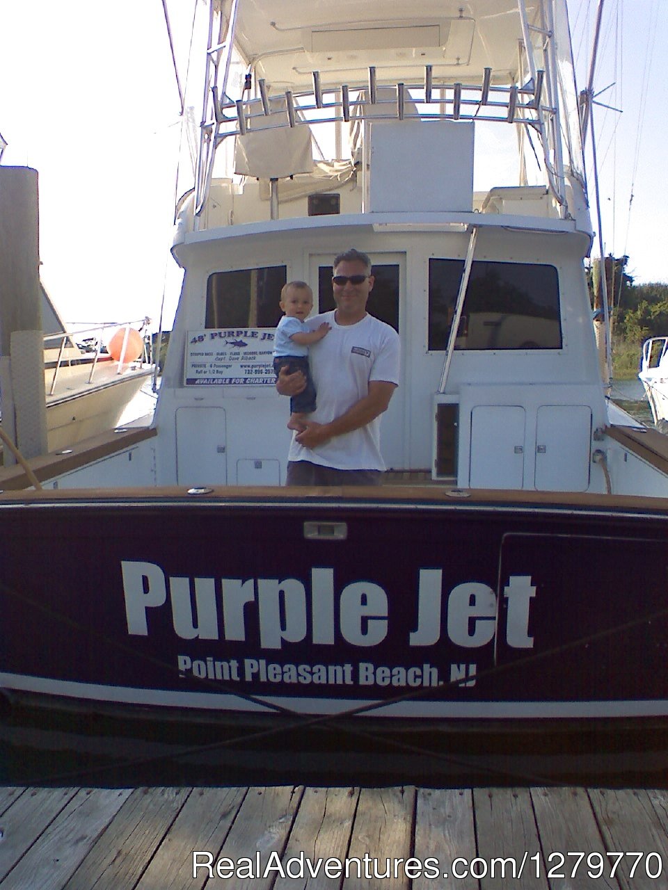 Capt Dave with a 1 year old Brody 2010 | Purple Jet Charter Sportfishing Fleet | Image #22/26 | 
