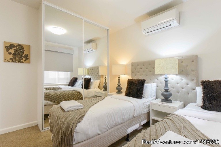 Brunswick serviced apartment showing queen bed split in two | Brunswick Parkville 2 bedroom near trams & shops | Image #4/7 | 